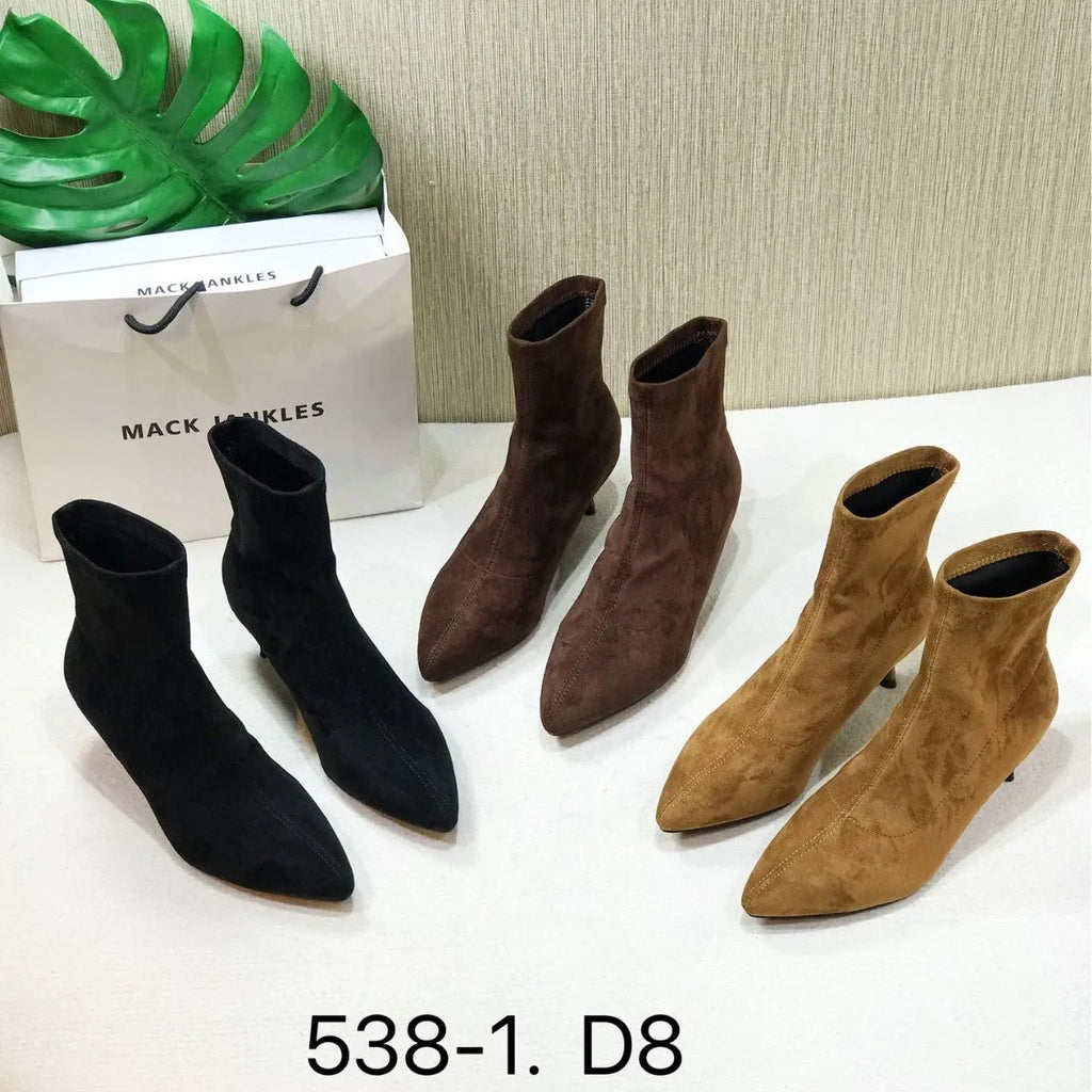 Women's black pointed toe ankle boots with stiletto heel and mid-calf length