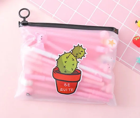Open plastic case showing twenty 0.5mm black gel pens with cartoon cactus designs for boys and girls.