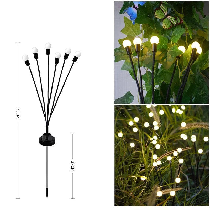 Solar-powered LED garden light with multiple heads on a metal spike in grass.