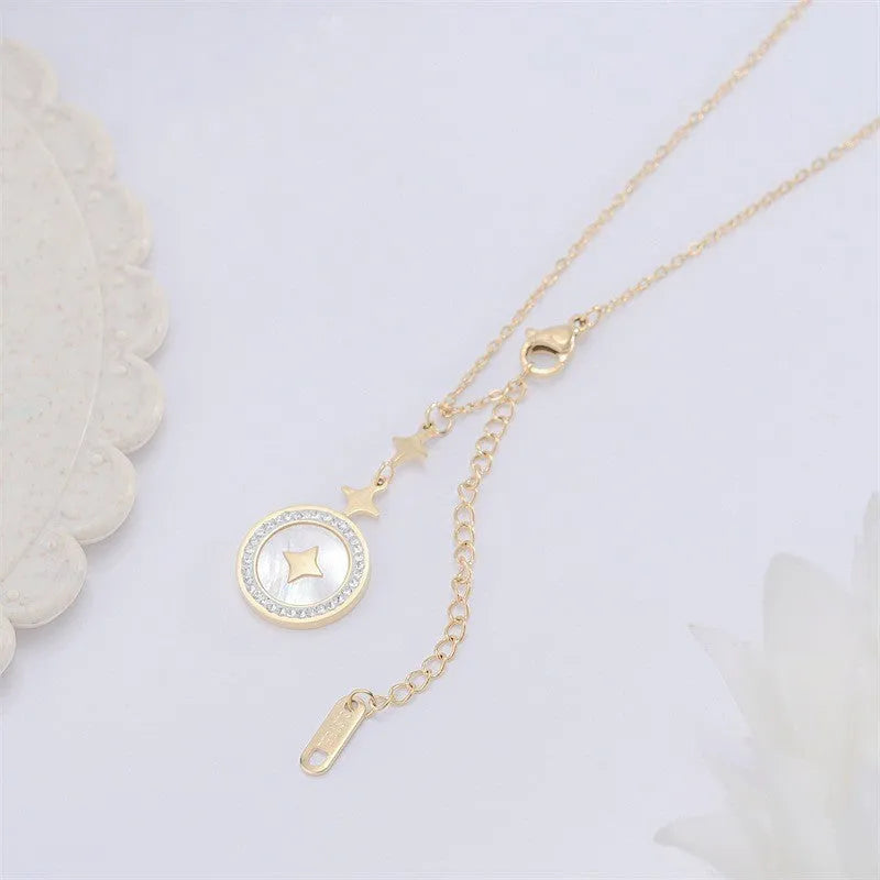 Close-up of a hexagonal six-pointed star titanium steel pendant necklace on a gold O-ring chain.