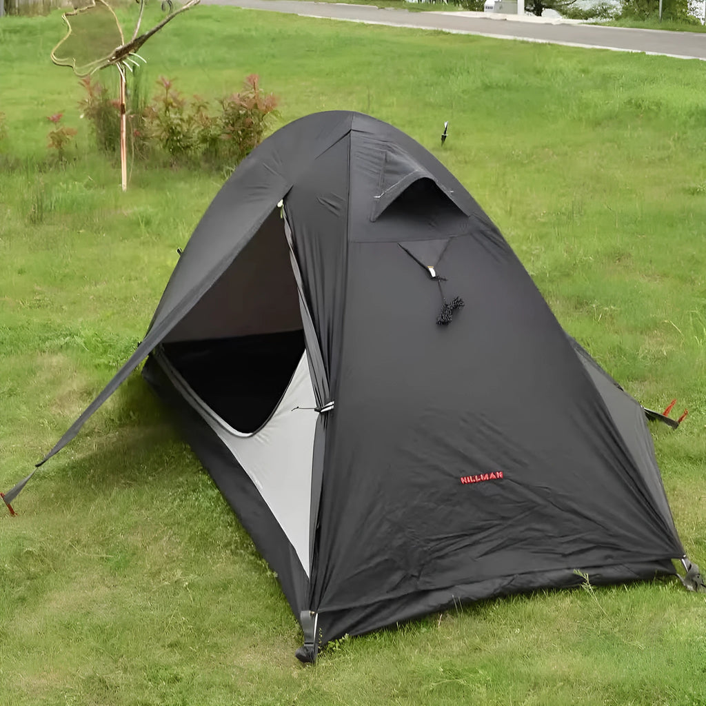 Single person hiking tent with aluminium poles pitched in outdoor setting showing red colour option