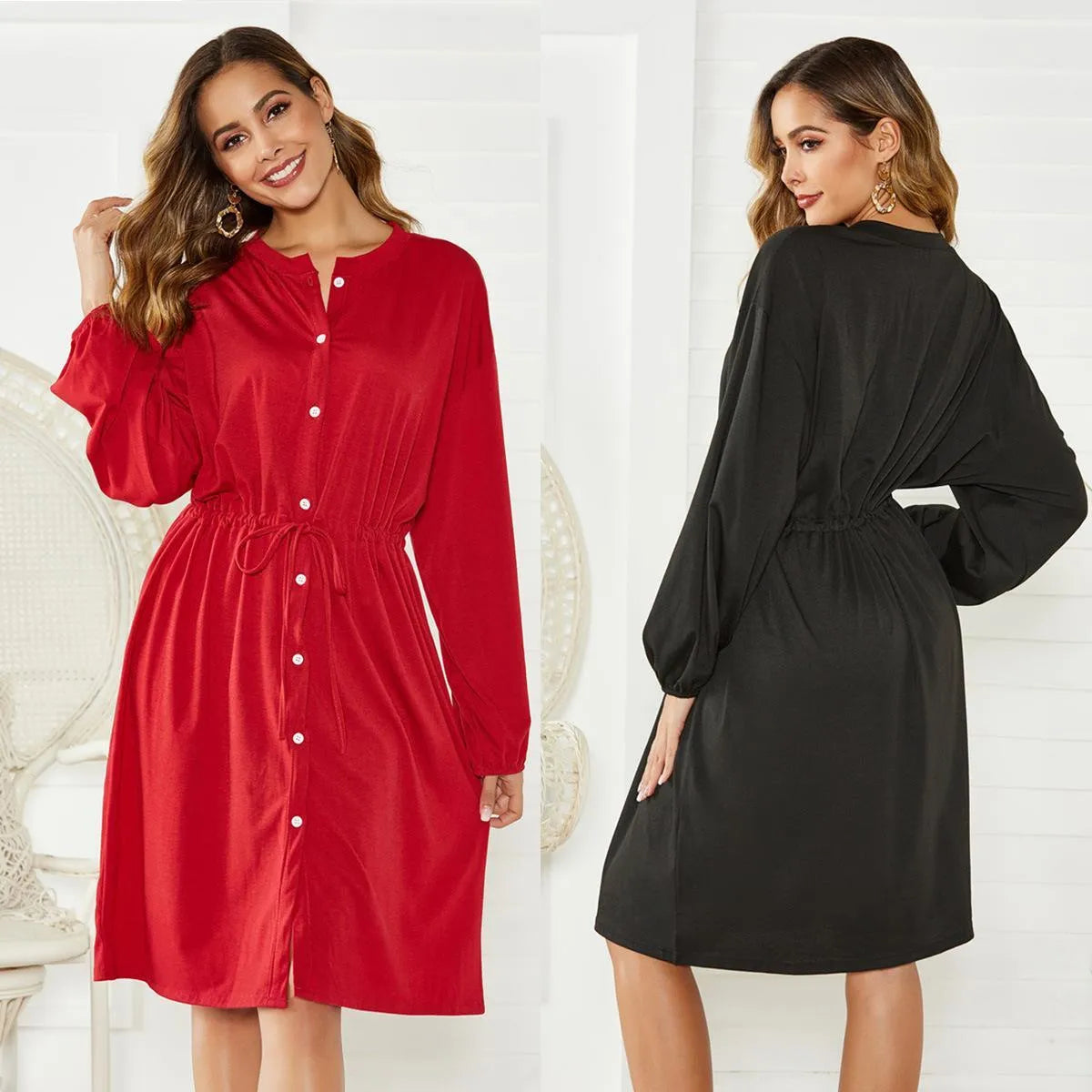 Black A-line midi dress with long sleeves, elastic waist, belt, and elastic cuffs on a mannequin.