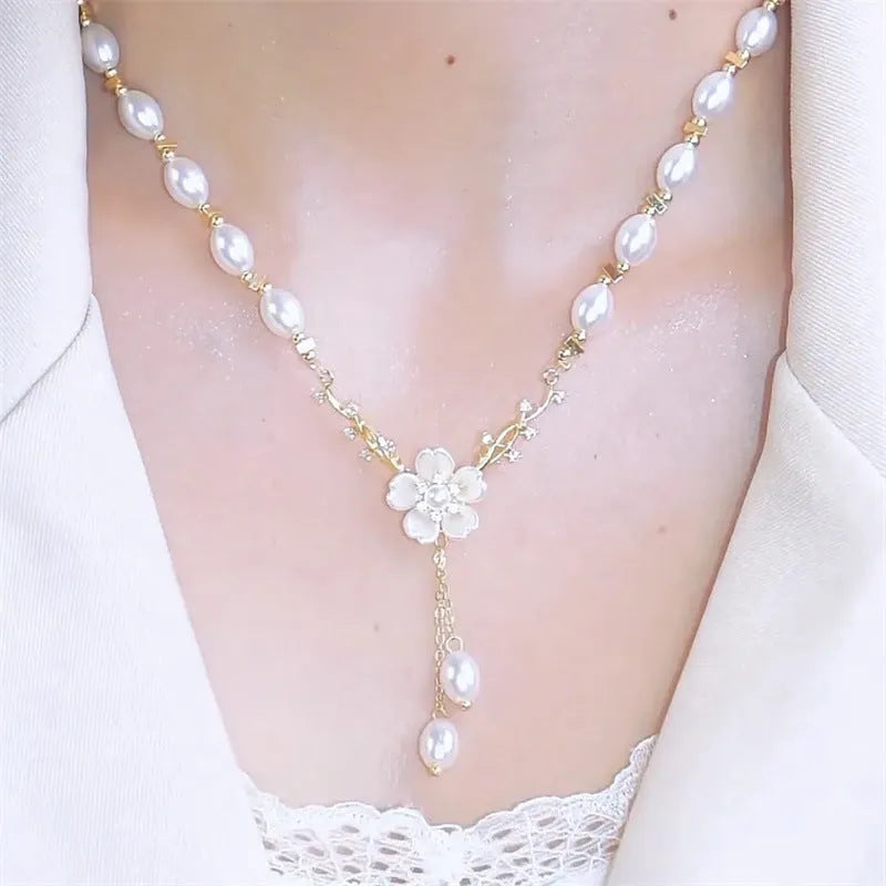 Alloy necklace with pearl chain and floral rose pendant in pearl flower colour.