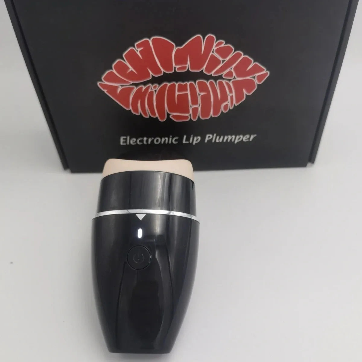 Black and white electric silicone lip plumper device with USB charging cable