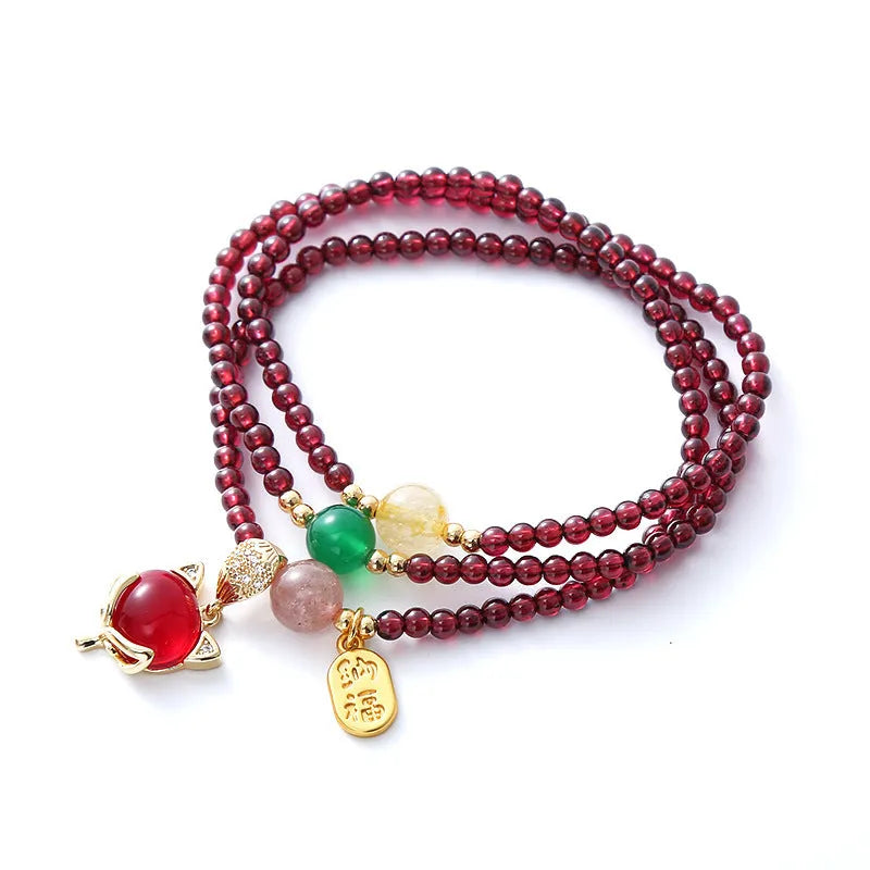 Purplish red garnet fox charm bracelet with adjustable cord fastening for women