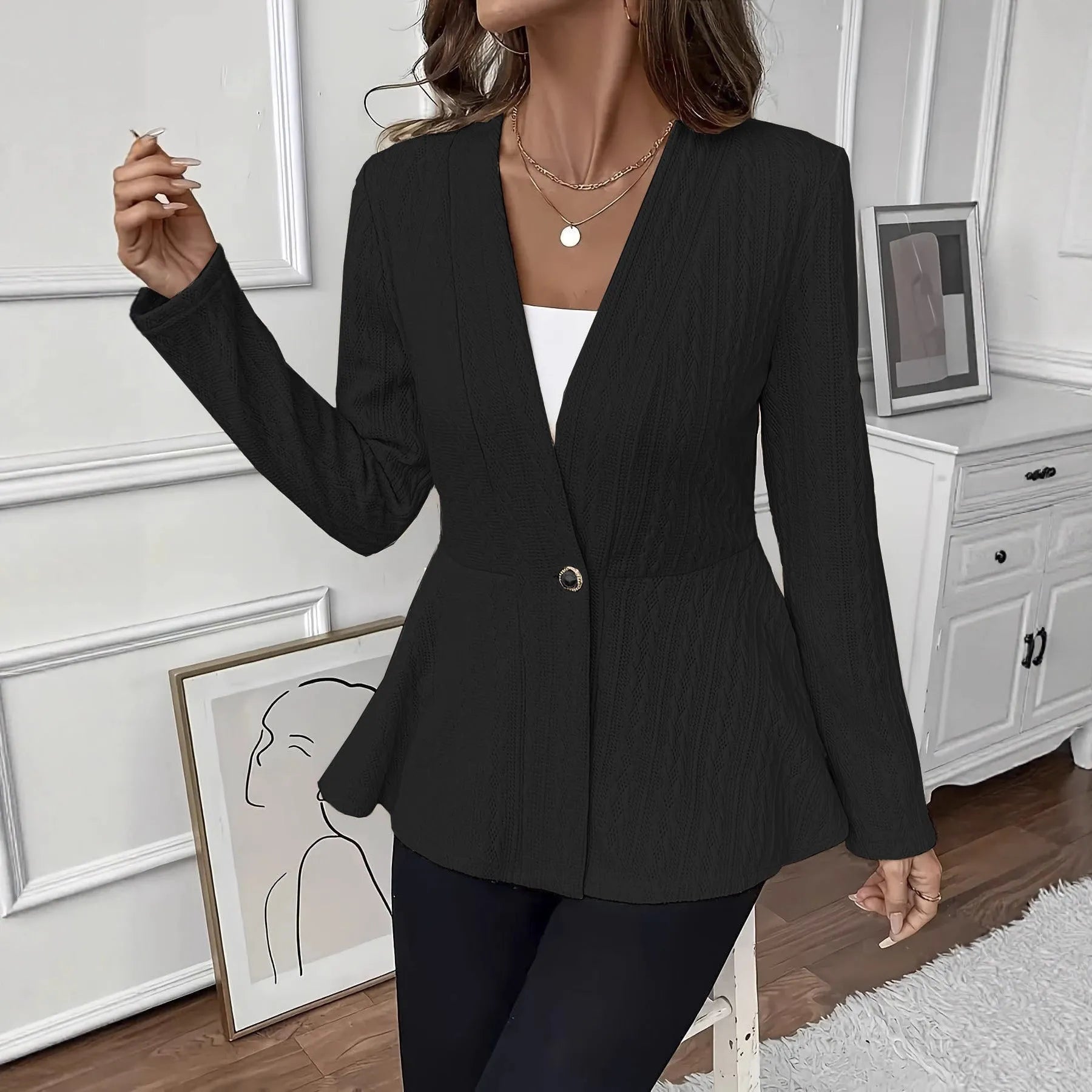 Women's apricot jacquard knit cardigan with one button front, shown on a model.