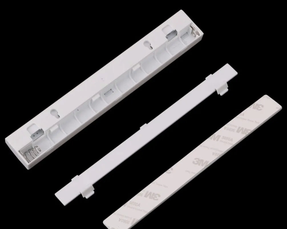 USB rechargeable LED motion sensor strip light with magnetic back, shown illuminating a wardrobe.
