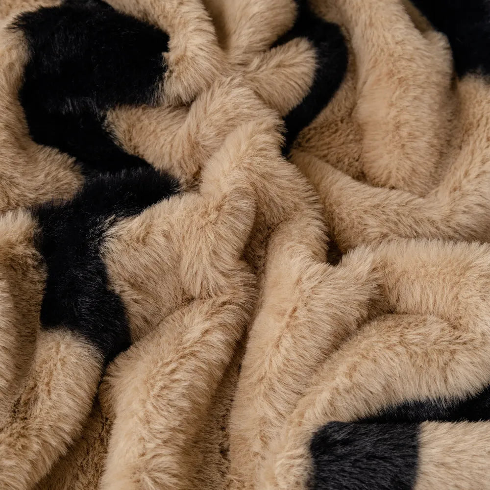 Zebra pattern flannel sofa cover and pillowcase set on a sofa, shown in caramel colour.
