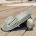 Women's grey blue buckle flip-flop with soft EVA sole and adjustable strap.