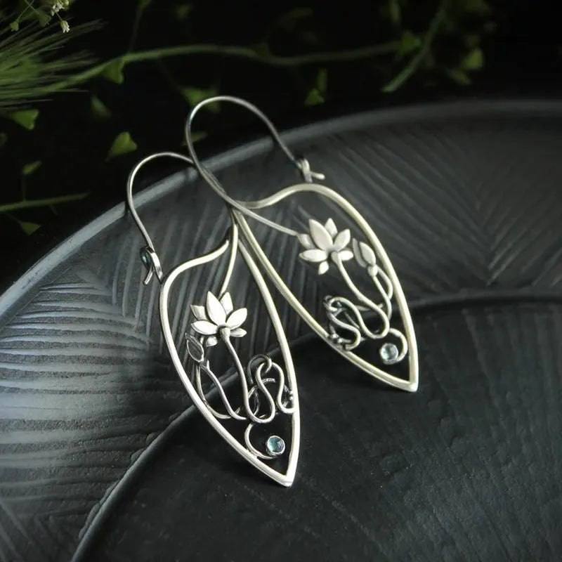 Silver lotus flower earrings with rhinestones on geometric alloy setting