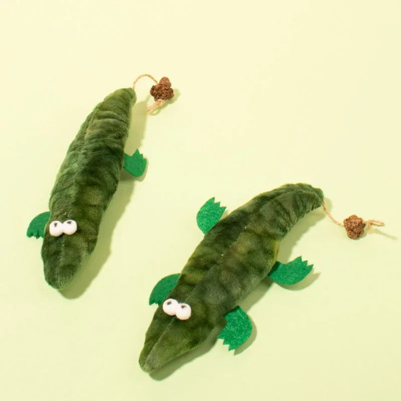 Green plush alligator catnip toy with peppermint scent for oral cleansing and stress relief