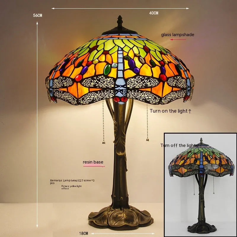 Stone table lamp with Tiffany-style blue dragonfly design on base