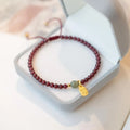 Hand-woven red rope bracelet with strawberry quartz beads in national tide style for women