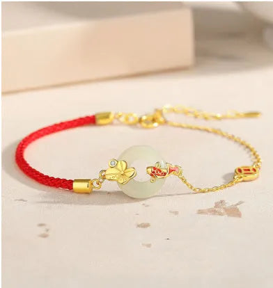 Gold electroplated Koi Peace Buckle Hetian Jade Red Rope Bracelet with safety clasp and animal zodiac design