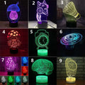 Black remote control LED desk lamp with colourful 3D lighting on a modern acrylic board.