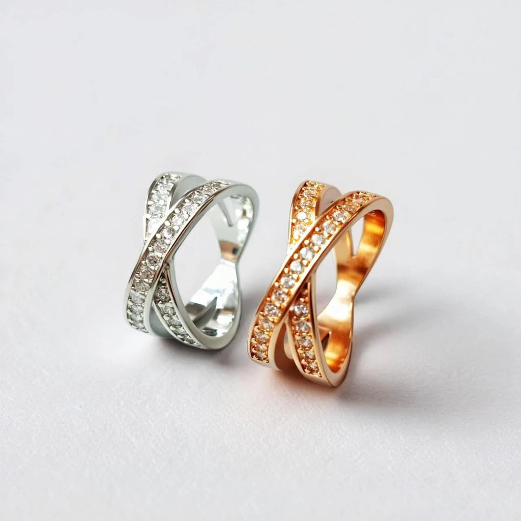 Silver and rose gold metal cross ring with micro-inlaid zircon detailing in heart and geometric design