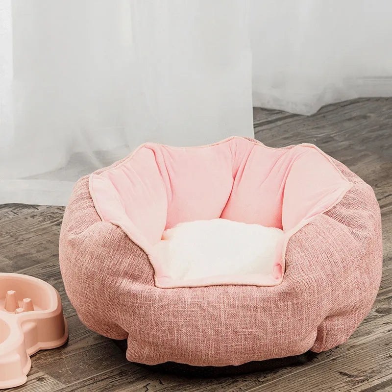 Octagonal grey pet bed with soft padded rim and removable inner mat for a small dog