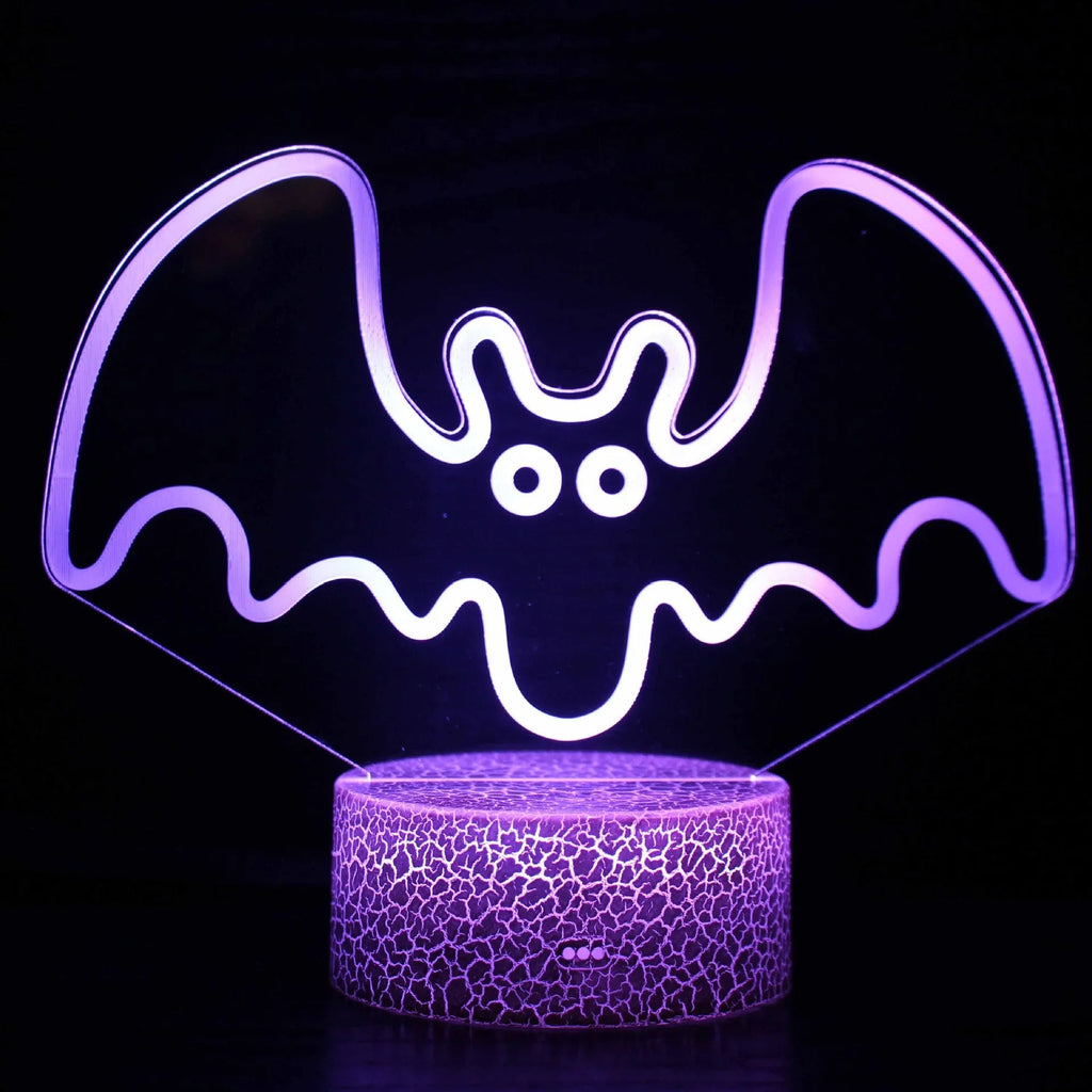 Small acrylic 3D touch-controlled USB table lamp with colourful crack-effect base on a desk.