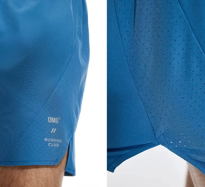 Men's black four-point running shorts with laser stitching on a flat surface, showing stretch fabric.