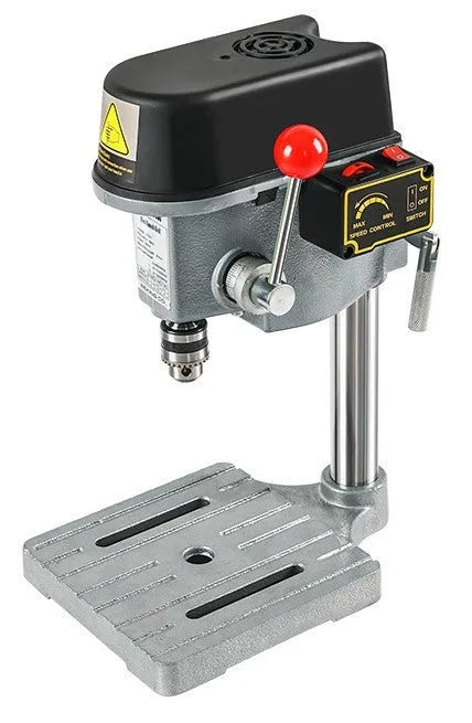 Mini bench drill and milling machine on a workbench with cross bench pliers.