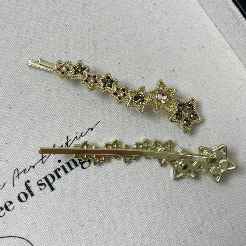Gold electroplated rhinestone barrette with star design hair clip