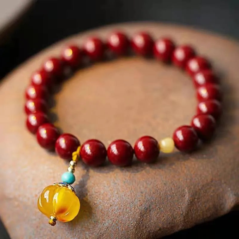 Gold cinnabar wave bracelet with copper beads in national style design