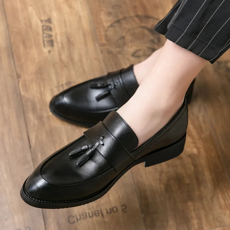 Men's black slip-on business casual shoes with tassel detail and rubber sole
