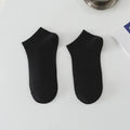 A pair of solid colour low-cut men's boat socks made from breathable polyester fibre.