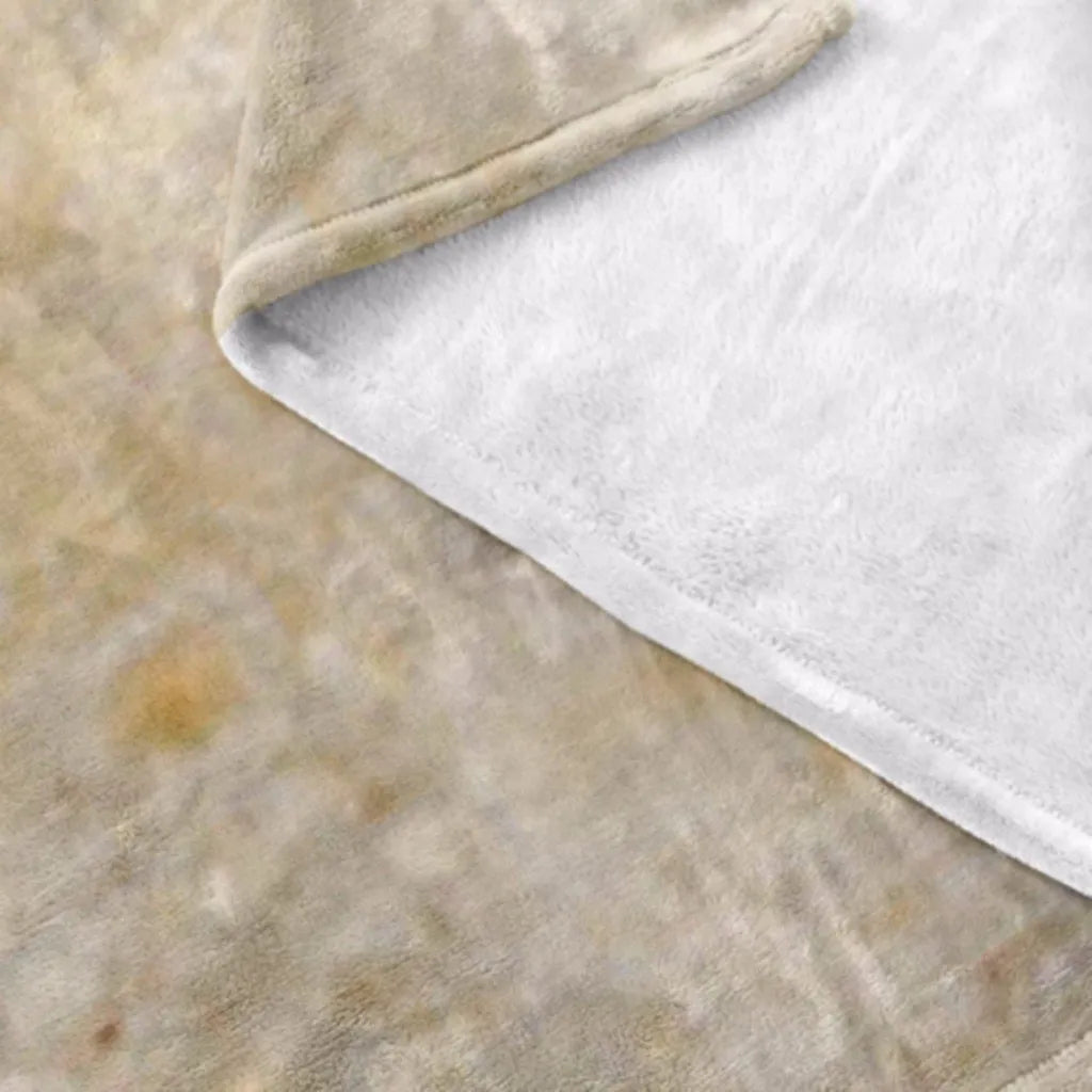 Round coral-coloured flannel burrito blanket with a delicious food print, folded to show soft texture.