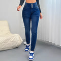 Dark blue women's straight-leg denim trousers with breasted button fastening on a hanger.
