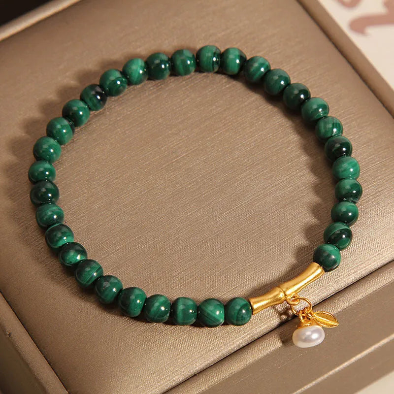 Women's adjustable bamboo bracelet with white crystal elements on a wrist.