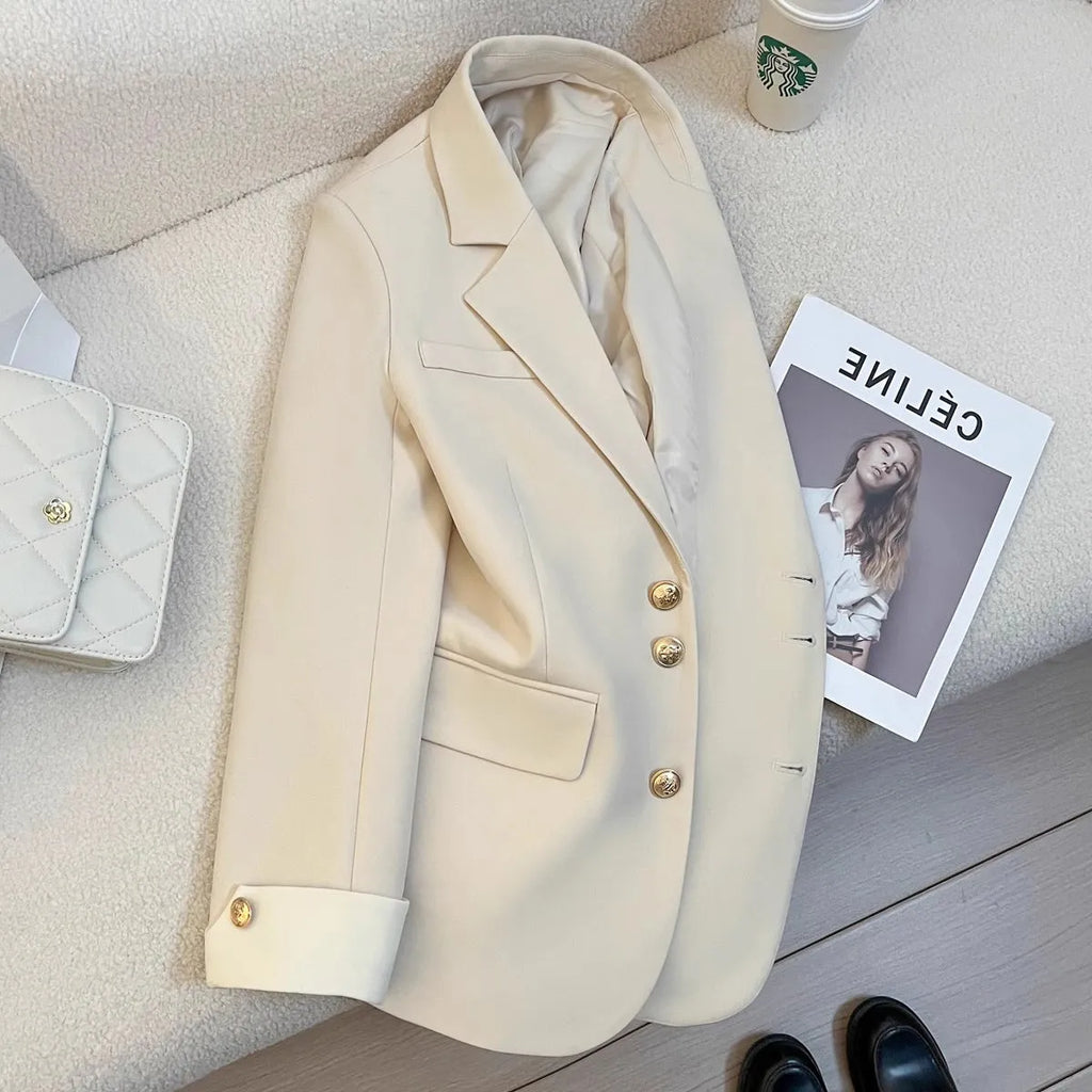 Women's loose-fit polyester commuting coat in milky white, showing long sleeves and pockets.
