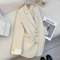 Women's loose-fit polyester commuting coat in milky white, showing long sleeves and pockets.
