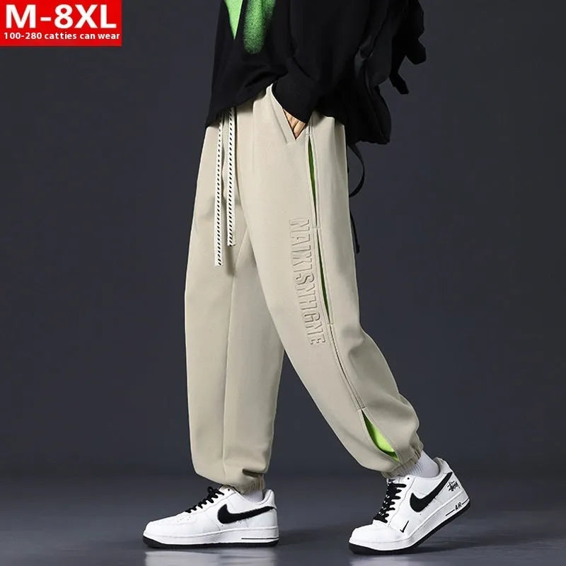 Men's loose-fit cotton trousers with stitching print detail and a banded ankle cuff.