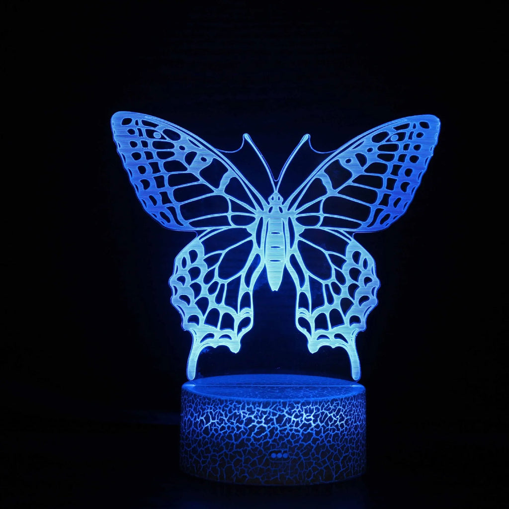 Small acrylic 3D touch-controlled USB table lamp with colourful crack-effect base on a desk.