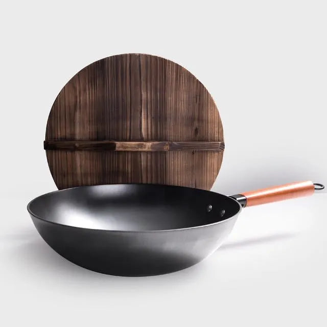 Traditional black iron wok with wooden handle, 40cm diameter.