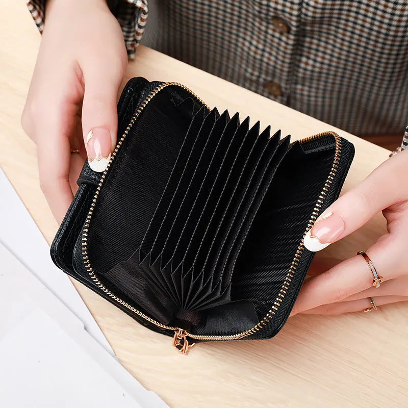 Women's lychee pattern PU leather short wallet showing card slots and cash compartment