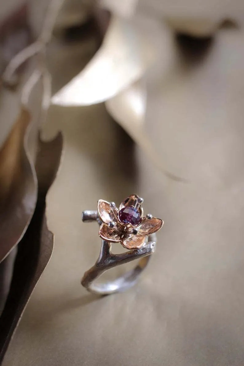 Silver two-tone floral geometric alloy ring showing detailed patterning