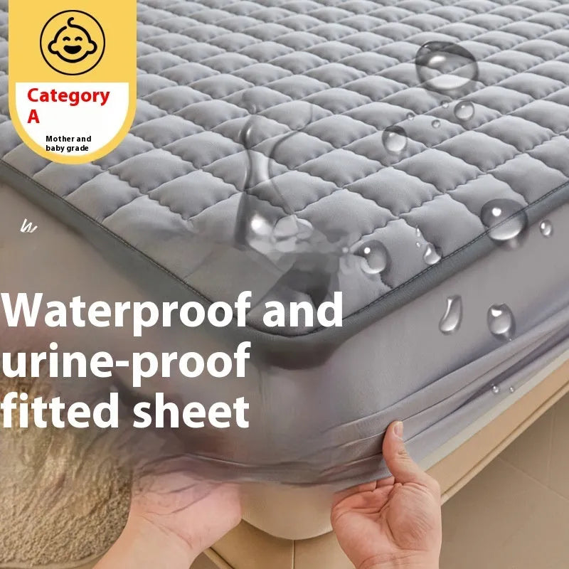 Blue washed cotton waterproof fitted sheet with elasticated corners on a mattress.