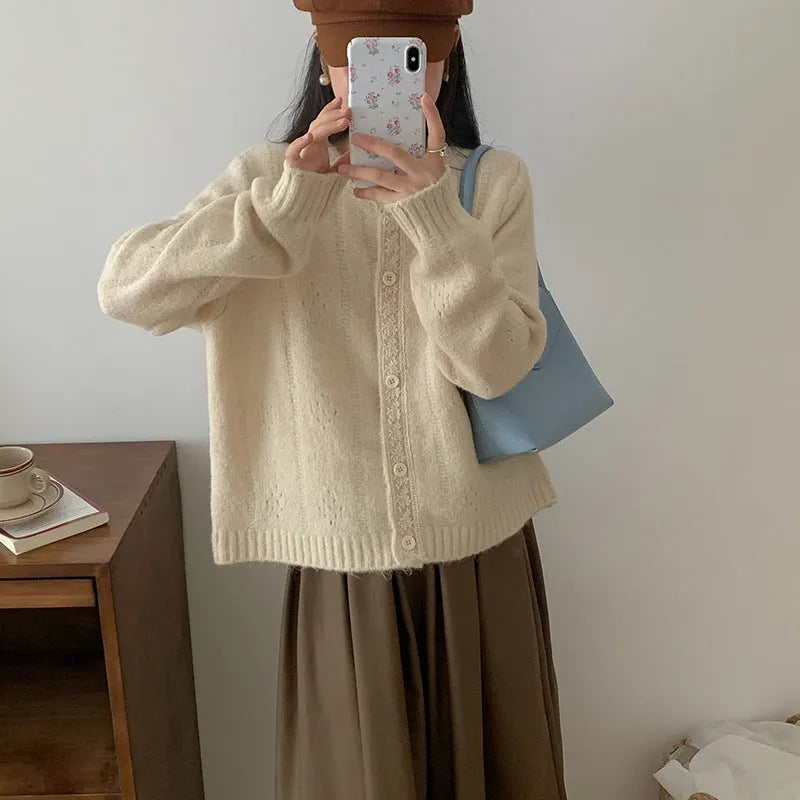 Loose-fit retro style cardigan coat in viscose knit, shown in apricot colour.