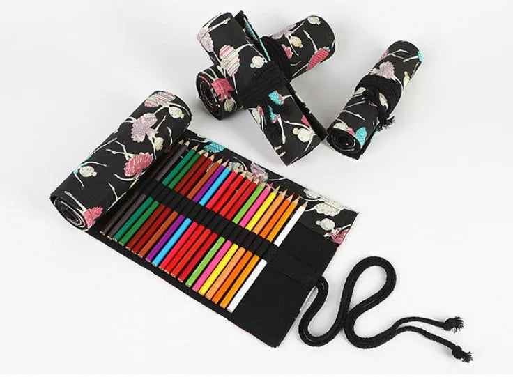 Square canvas rolling pencil case with ballet girl print, showing multiple holes for pencils.