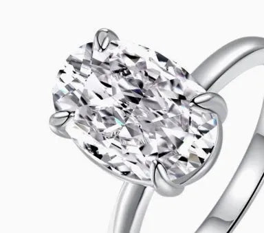 Oval gemstone ring in 925 silver with four-claw setting, showing 6x9mm centrepiece