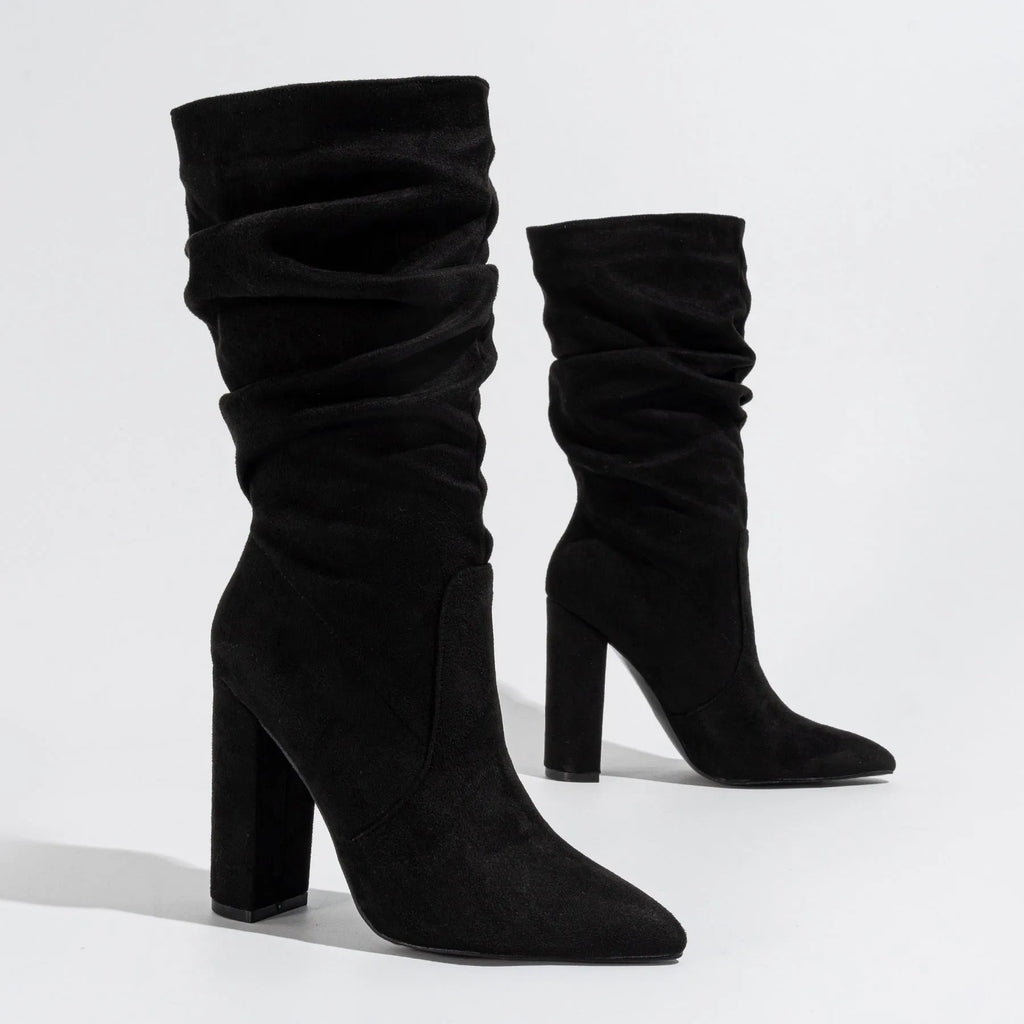 Women's black suede boots with chunky high heels and pointed toe design