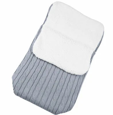 Envelope-style baby stroller sleeping bag in beige colour showing thick cotton wool filling and soft lining.