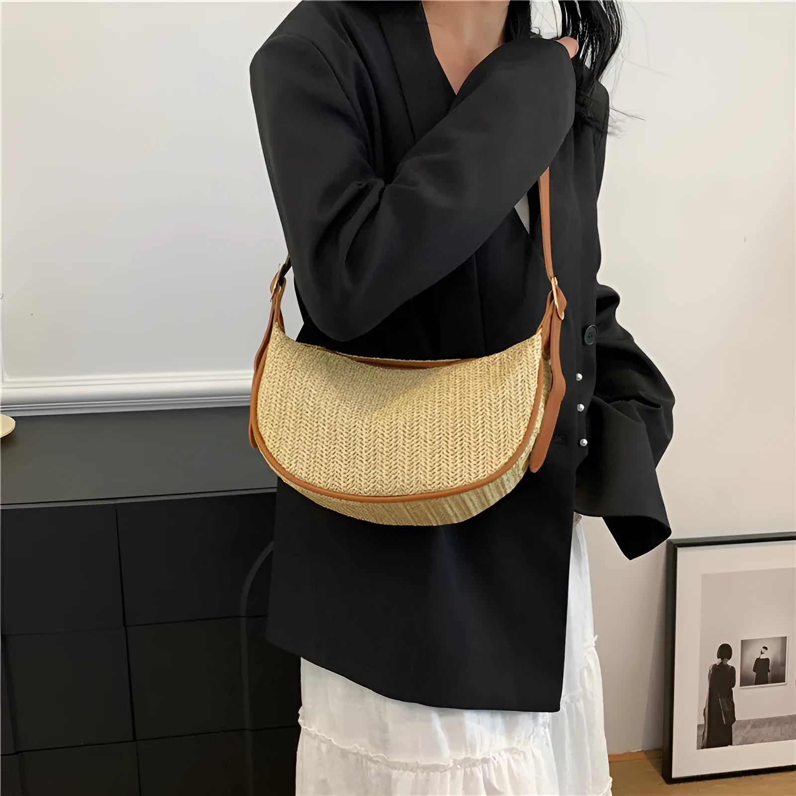 Women's knitted straw woven crossbody bag showing woven texture and internal phone/document compartments