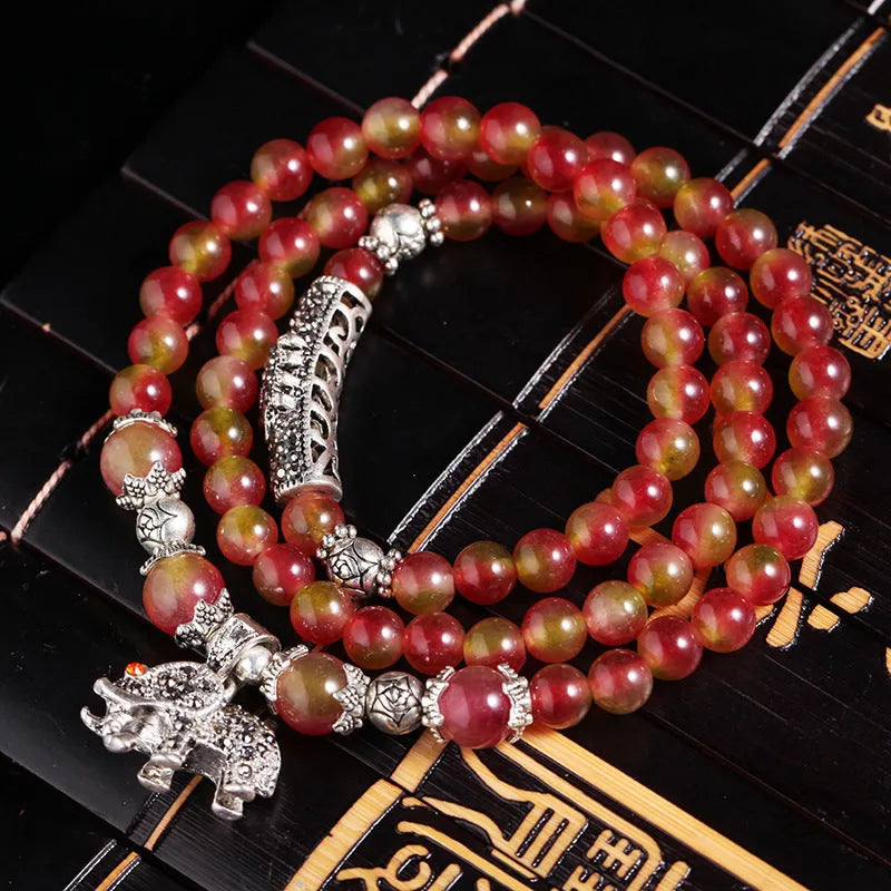 Handmade watermelon crystal bracelet with traditional Chinese knot design in geometric beads
