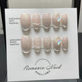 Blush coloured short square false nail set for ladies, showing nails in extra small, small, medium, and large sizes.