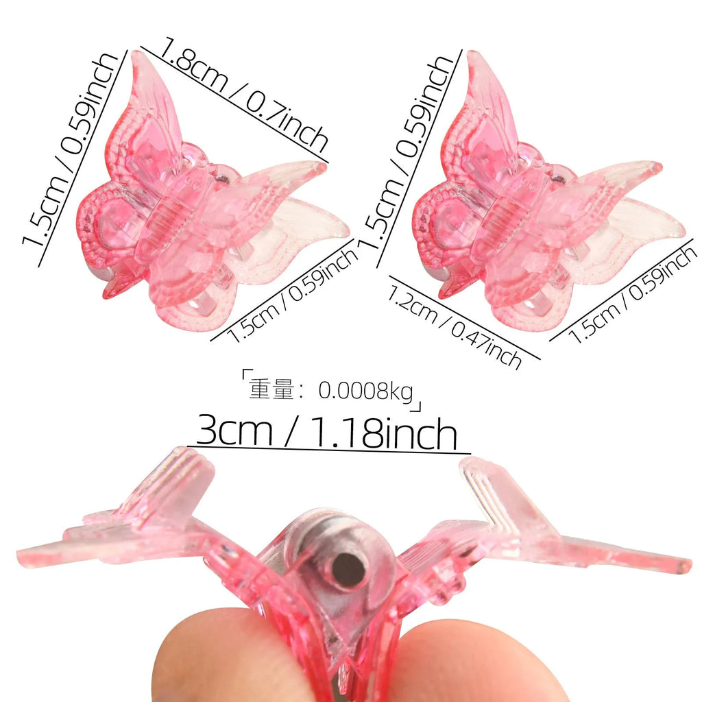 Set of 50 small glitter butterfly hair claw clips in assorted colours on a white background.