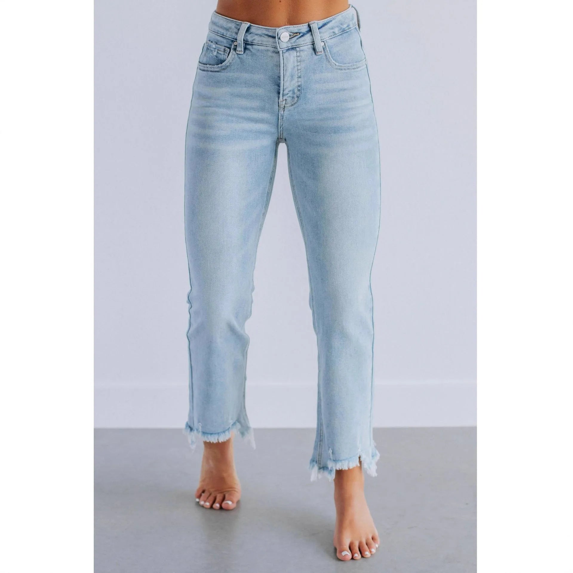 Women's dark blue casual denim jeans with hand-worn distressing on a solid cotton fabric
