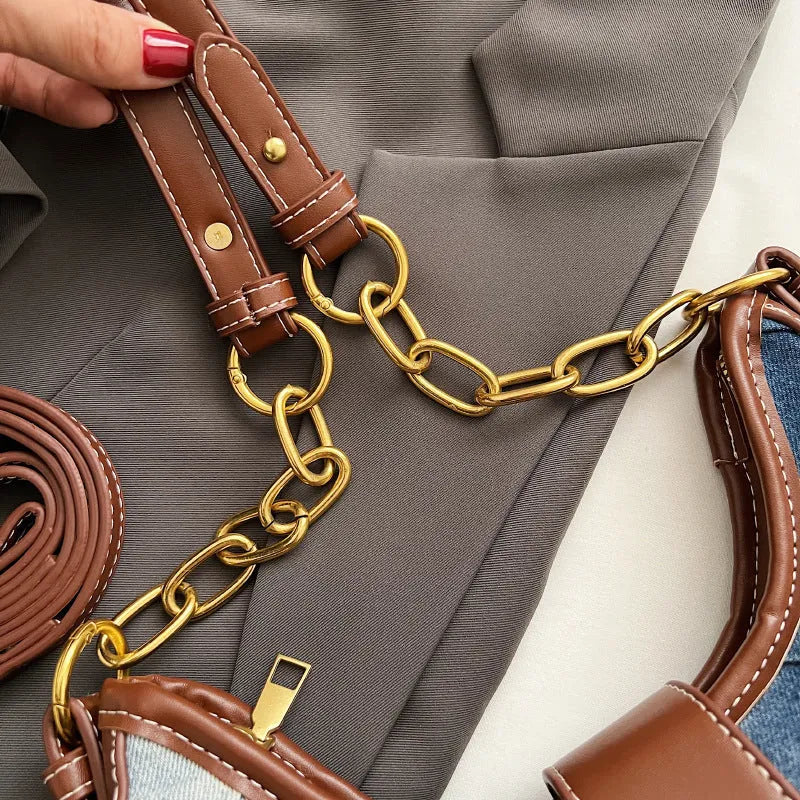 Brown denim women's bucket shoulder bag with chain strap and diamond mesh detail.
